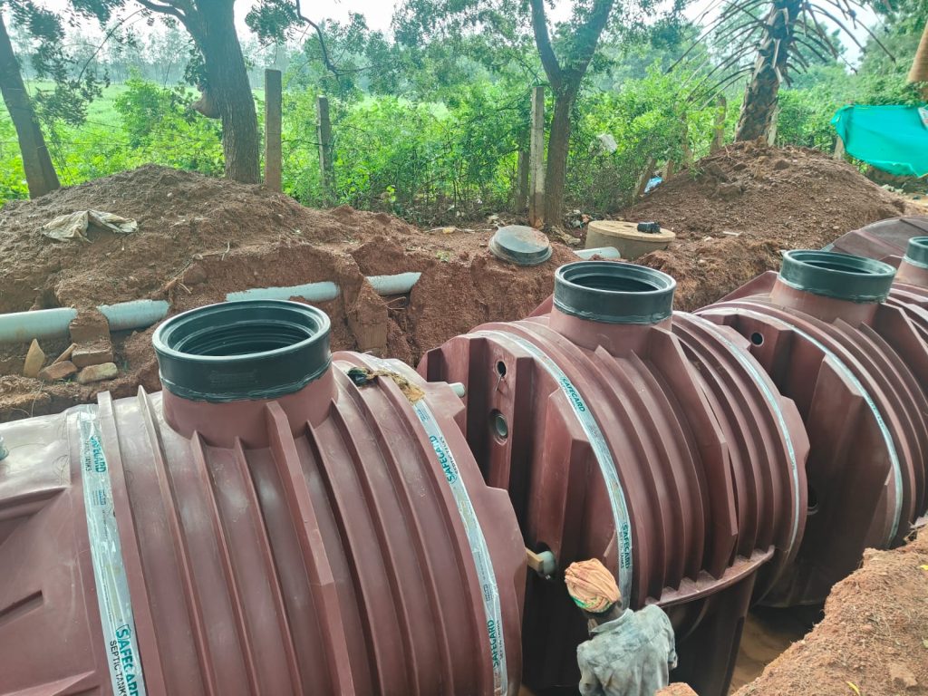 Installation of a packaged STP plant with dual underground tanks at a construction site.